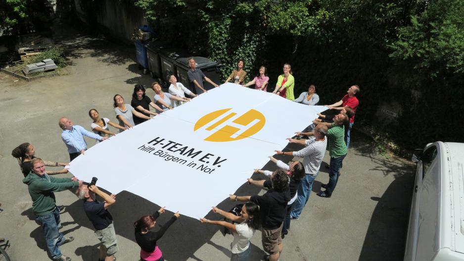 H-Team e.V. Foto H-Team Foto Team mit Logobanner